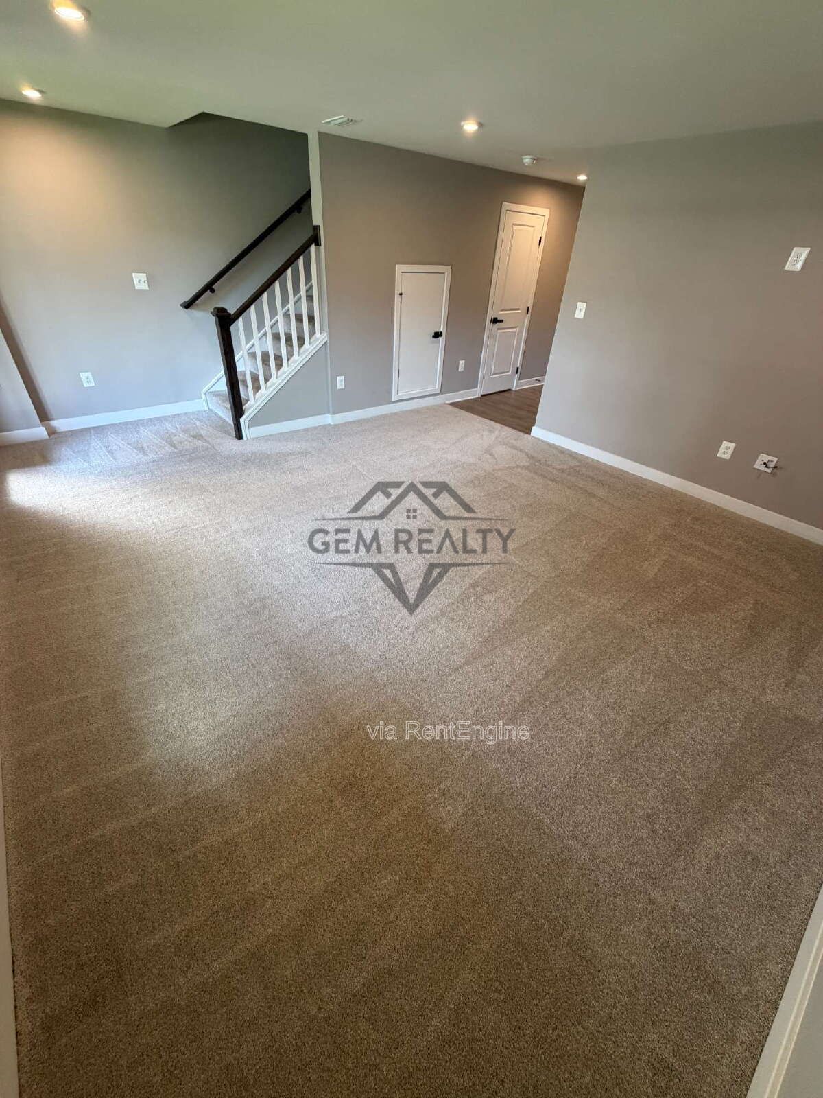 Welcome to Courthouse Commons Townhomes, where you can Rent a brand-new 3 BR 2.5 BA end unit townhome with a one-car garage and a spacious, open-concept floor plan designed for modern living. property image