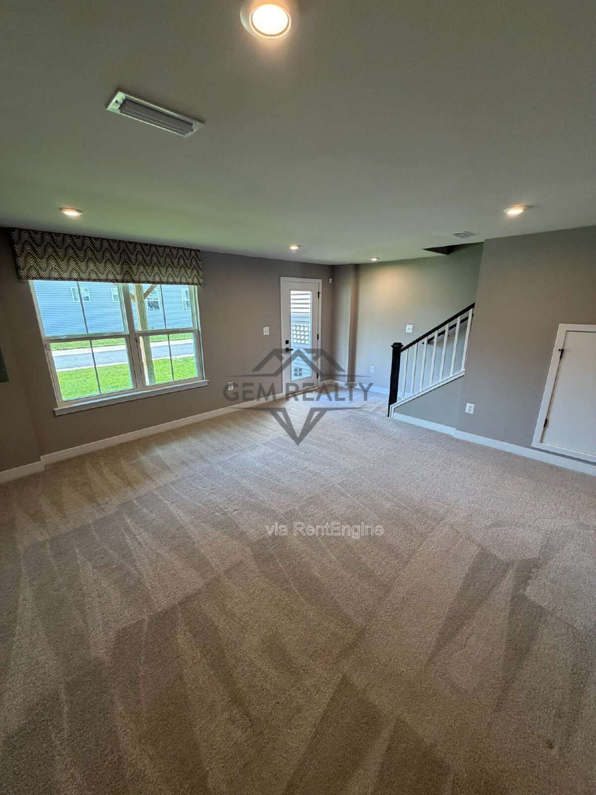 Welcome to Courthouse Commons Townhomes, where you can Rent a brand-new 3 BR 2.5 BA end unit townhome with a one-car garage and a spacious, open-concept floor plan designed for modern living. property image