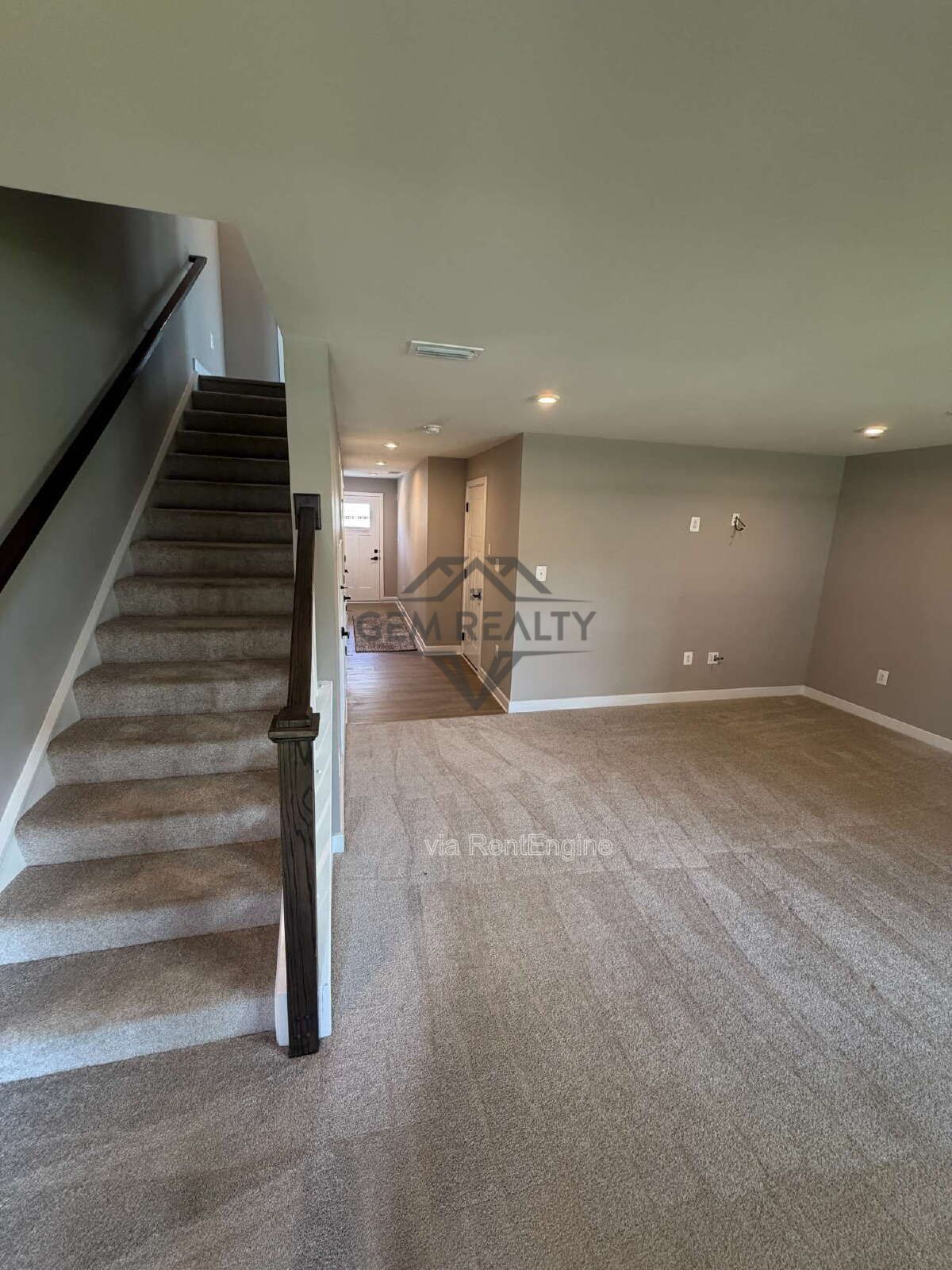 Welcome to Courthouse Commons Townhomes, where you can Rent a brand-new 3 BR 2.5 BA end unit townhome with a one-car garage and a spacious, open-concept floor plan designed for modern living. property image