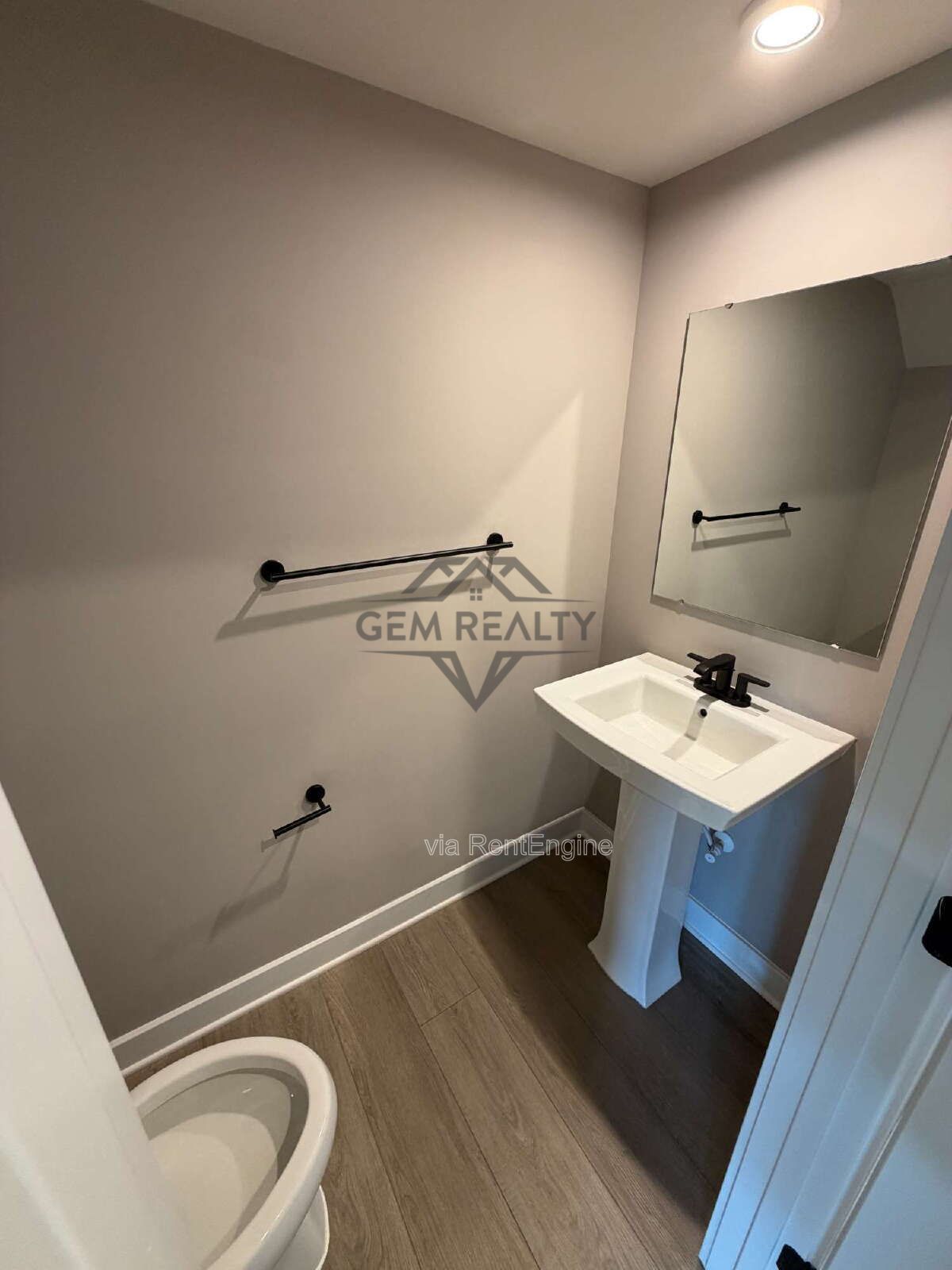 Welcome to Courthouse Commons Townhomes, where you can Rent a brand-new 3 BR 2.5 BA end unit townhome with a one-car garage and a spacious, open-concept floor plan designed for modern living. property image