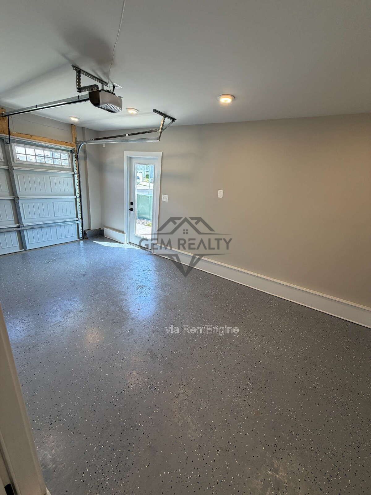 Welcome to Courthouse Commons Townhomes, where you can Rent a brand-new 3 BR 2.5 BA end unit townhome with a one-car garage and a spacious, open-concept floor plan designed for modern living. property image