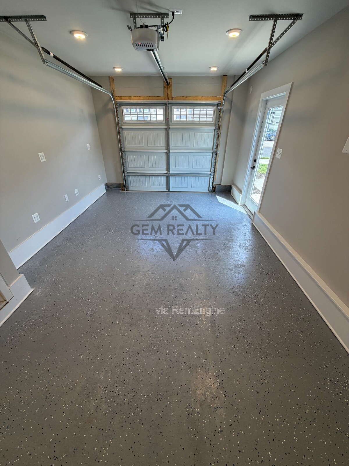 Welcome to Courthouse Commons Townhomes, where you can Rent a brand-new 3 BR 2.5 BA end unit townhome with a one-car garage and a spacious, open-concept floor plan designed for modern living. property image