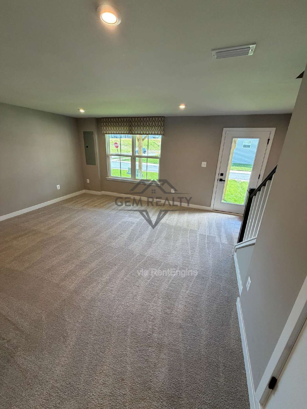 Welcome to Courthouse Commons Townhomes, where you can Rent a brand-new 3 BR 2.5 BA end unit townhome with a one-car garage and a spacious, open-concept floor plan designed for modern living. property image