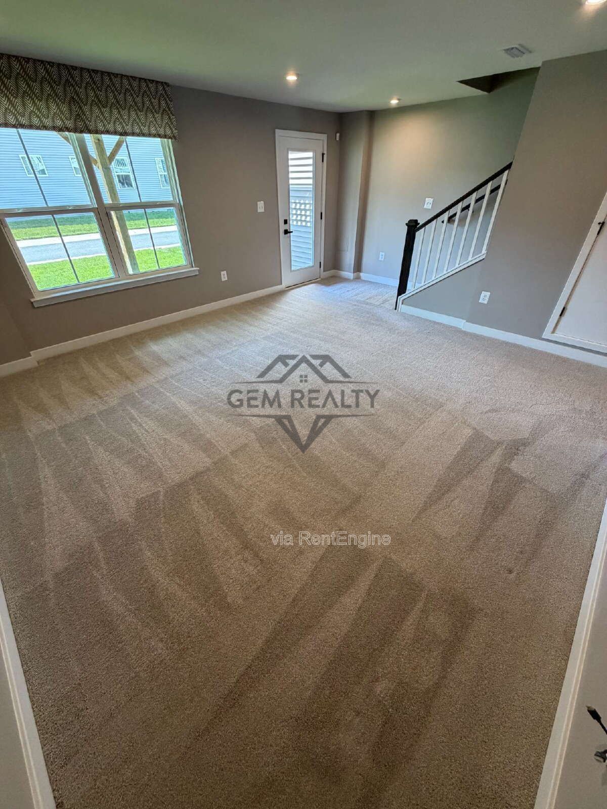 Welcome to Courthouse Commons Townhomes, where you can Rent a brand-new 3 BR 2.5 BA end unit townhome with a one-car garage and a spacious, open-concept floor plan designed for modern living. property image