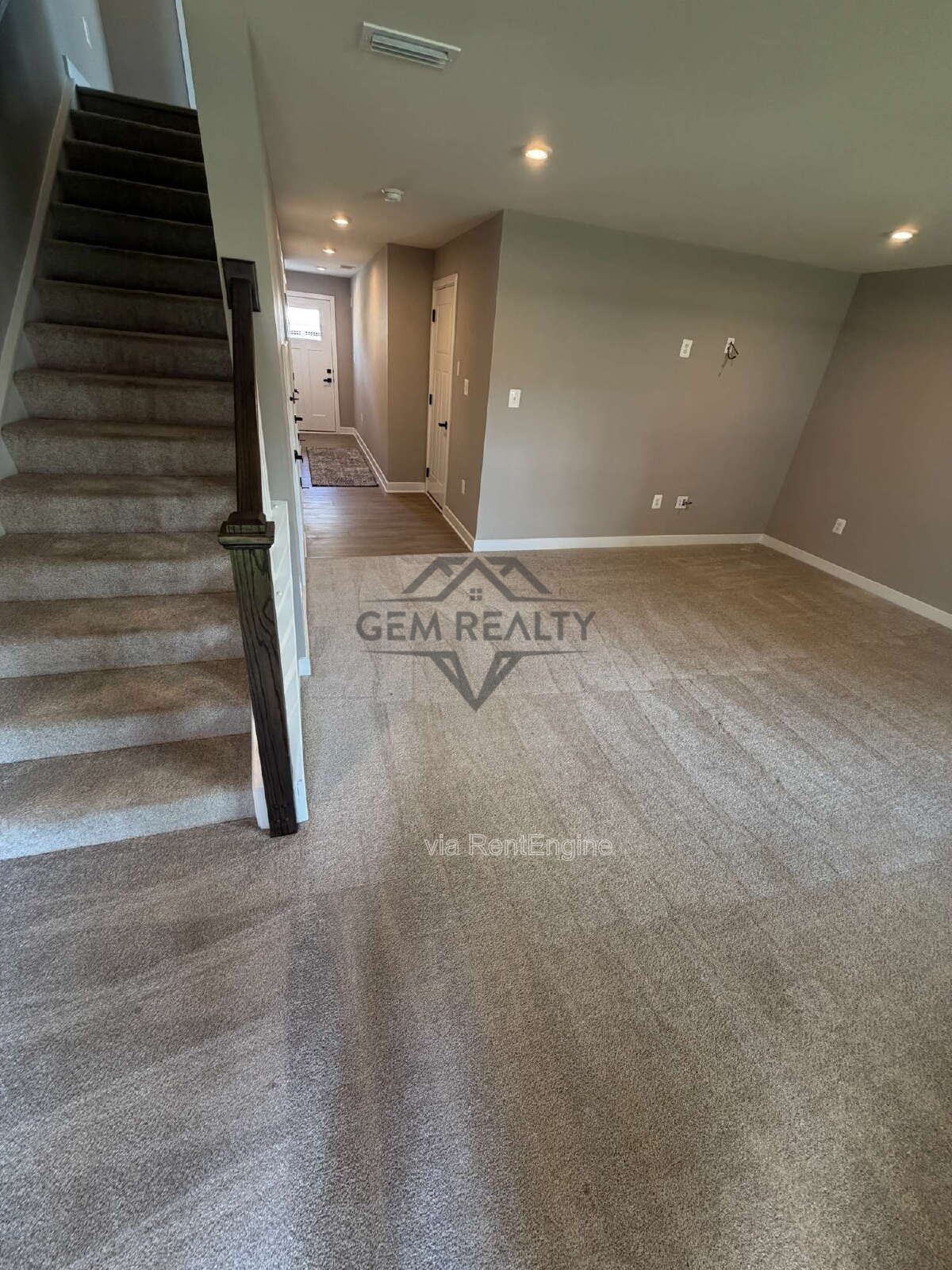 Welcome to Courthouse Commons Townhomes, where you can Rent a brand-new 3 BR 2.5 BA end unit townhome with a one-car garage and a spacious, open-concept floor plan designed for modern living. property image