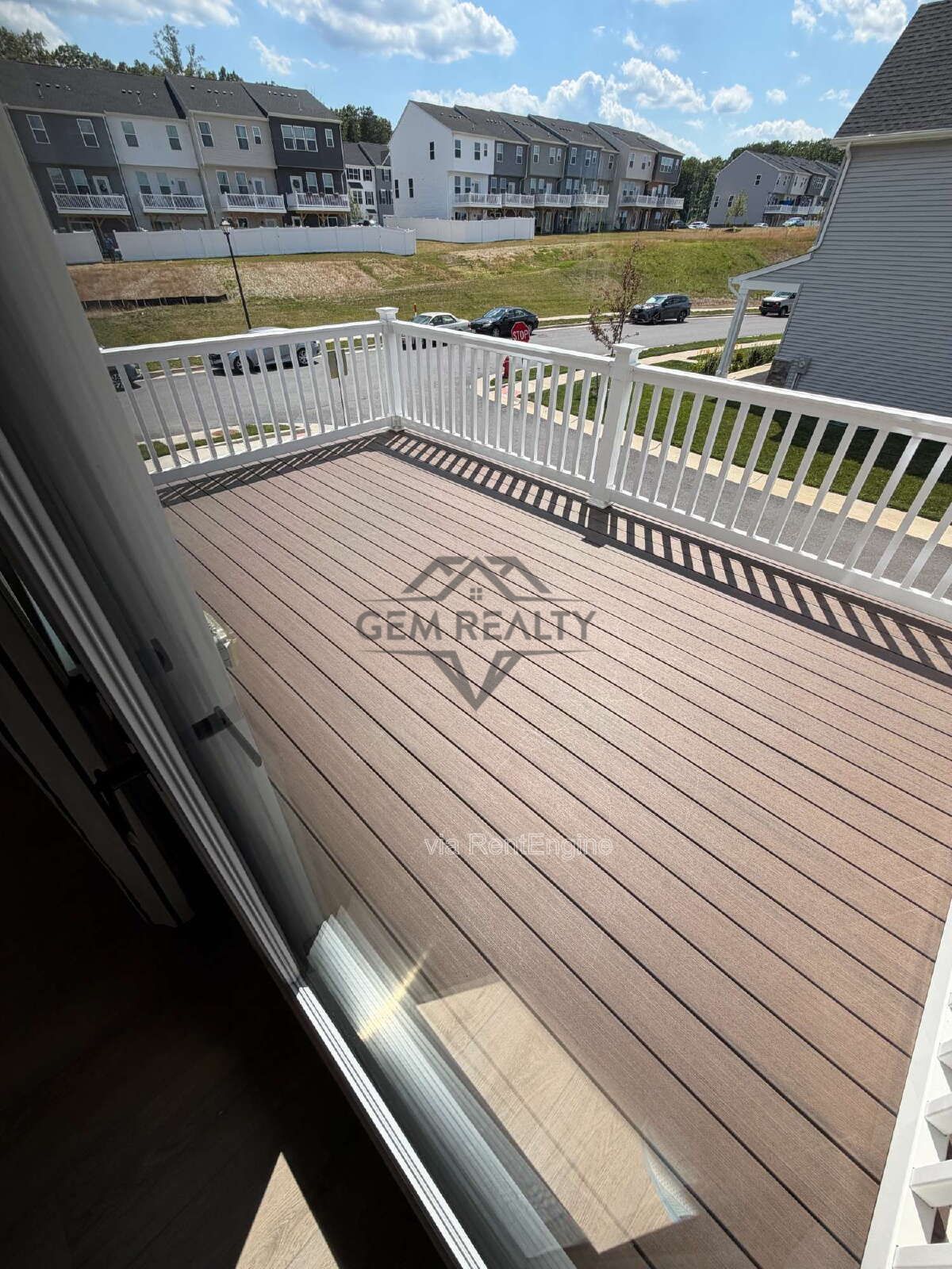 Welcome to Courthouse Commons Townhomes, where you can Rent a brand-new 3 BR 2.5 BA end unit townhome with a one-car garage and a spacious, open-concept floor plan designed for modern living. property image