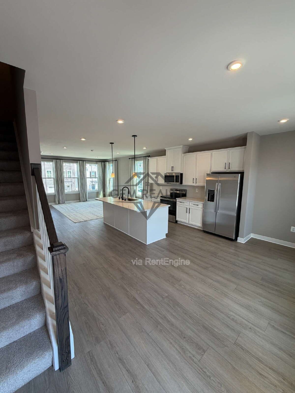 Welcome to Courthouse Commons Townhomes, where you can Rent a brand-new 3 BR 2.5 BA end unit townhome with a one-car garage and a spacious, open-concept floor plan designed for modern living. property image