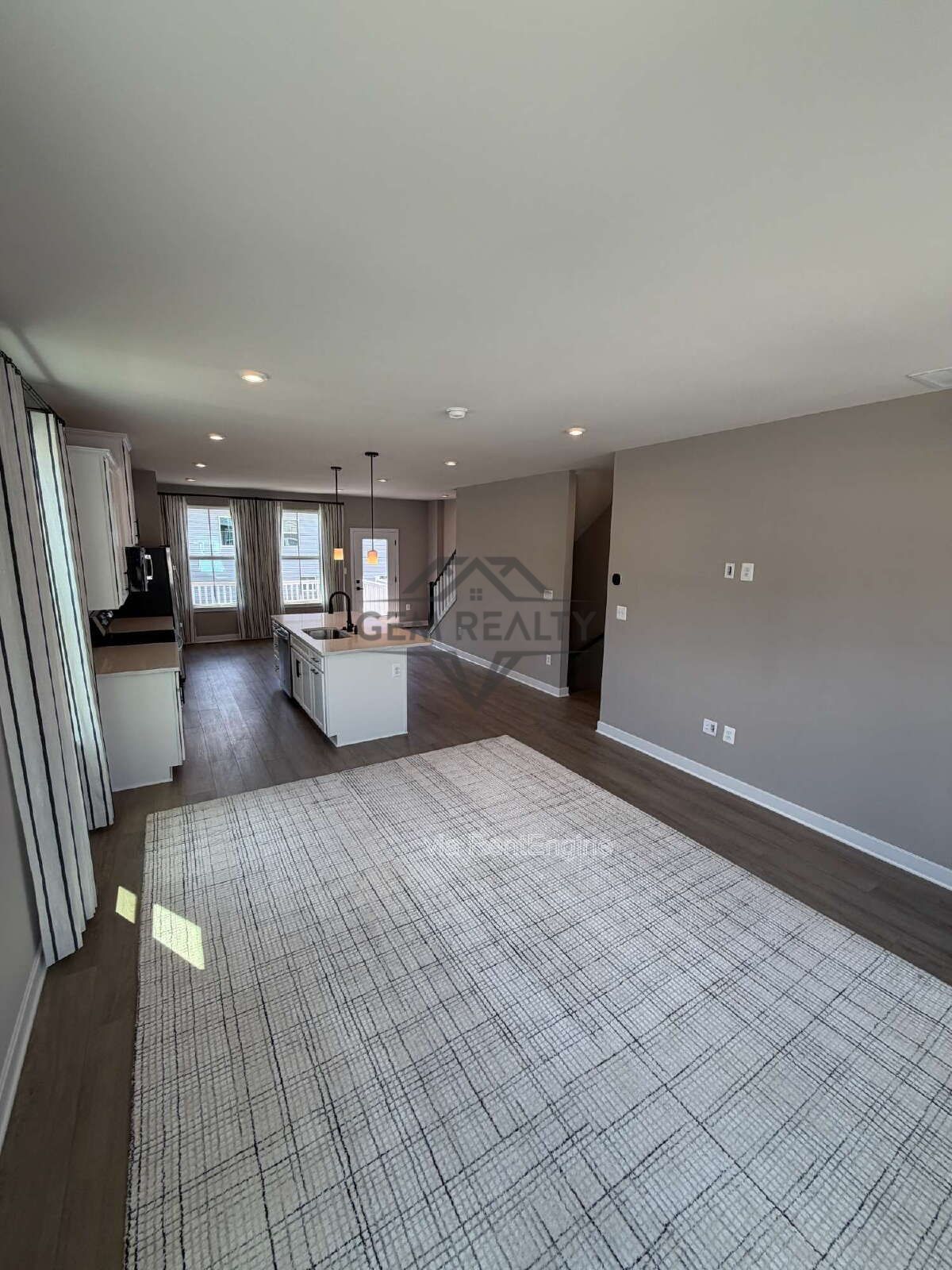 Welcome to Courthouse Commons Townhomes, where you can Rent a brand-new 3 BR 2.5 BA end unit townhome with a one-car garage and a spacious, open-concept floor plan designed for modern living. property image
