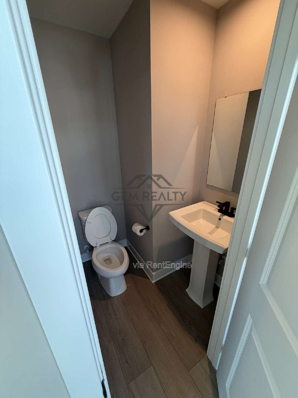 Welcome to Courthouse Commons Townhomes, where you can Rent a brand-new 3 BR 2.5 BA end unit townhome with a one-car garage and a spacious, open-concept floor plan designed for modern living. property image