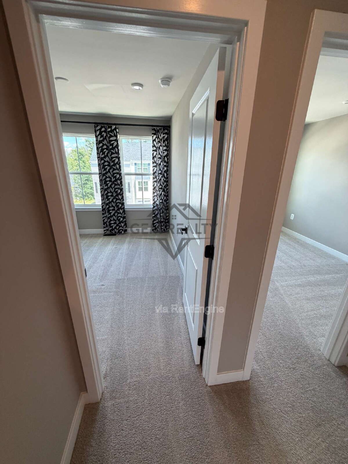 Welcome to Courthouse Commons Townhomes, where you can Rent a brand-new 3 BR 2.5 BA end unit townhome with a one-car garage and a spacious, open-concept floor plan designed for modern living. property image