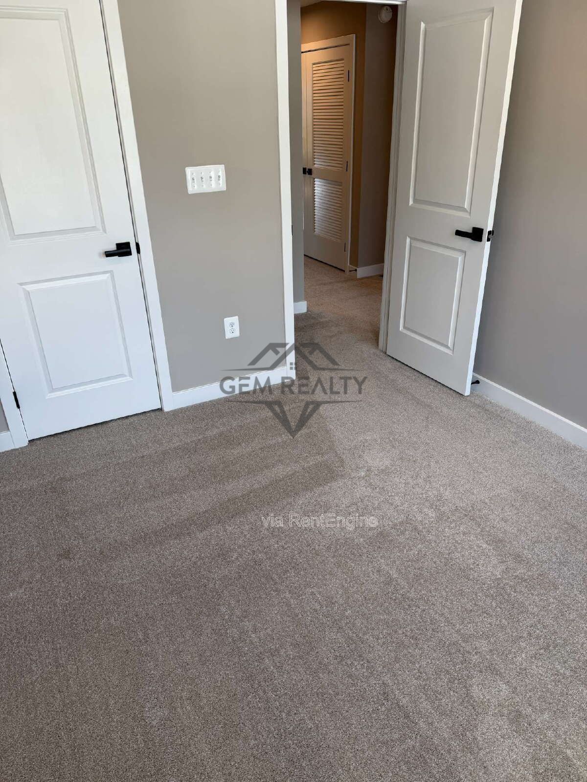 Welcome to Courthouse Commons Townhomes, where you can Rent a brand-new 3 BR 2.5 BA end unit townhome with a one-car garage and a spacious, open-concept floor plan designed for modern living. property image