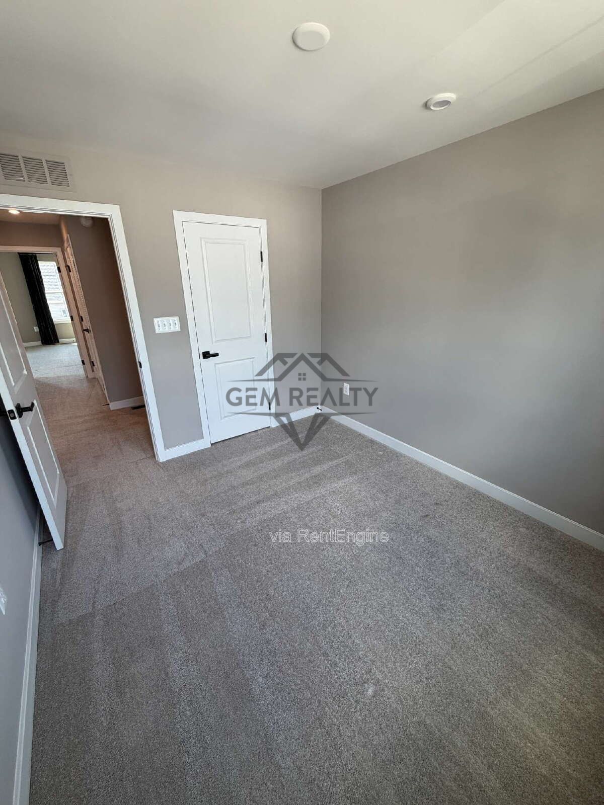 Welcome to Courthouse Commons Townhomes, where you can Rent a brand-new 3 BR 2.5 BA end unit townhome with a one-car garage and a spacious, open-concept floor plan designed for modern living. property image