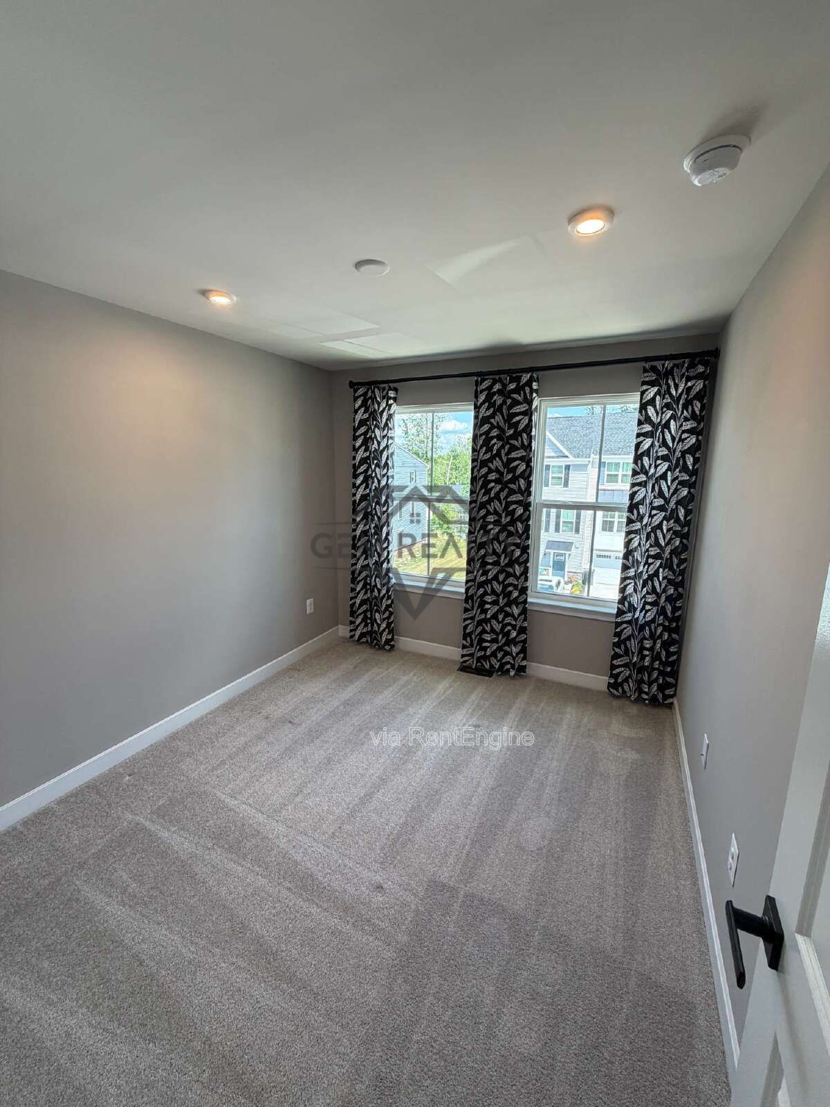 Welcome to Courthouse Commons Townhomes, where you can Rent a brand-new 3 BR 2.5 BA end unit townhome with a one-car garage and a spacious, open-concept floor plan designed for modern living. property image