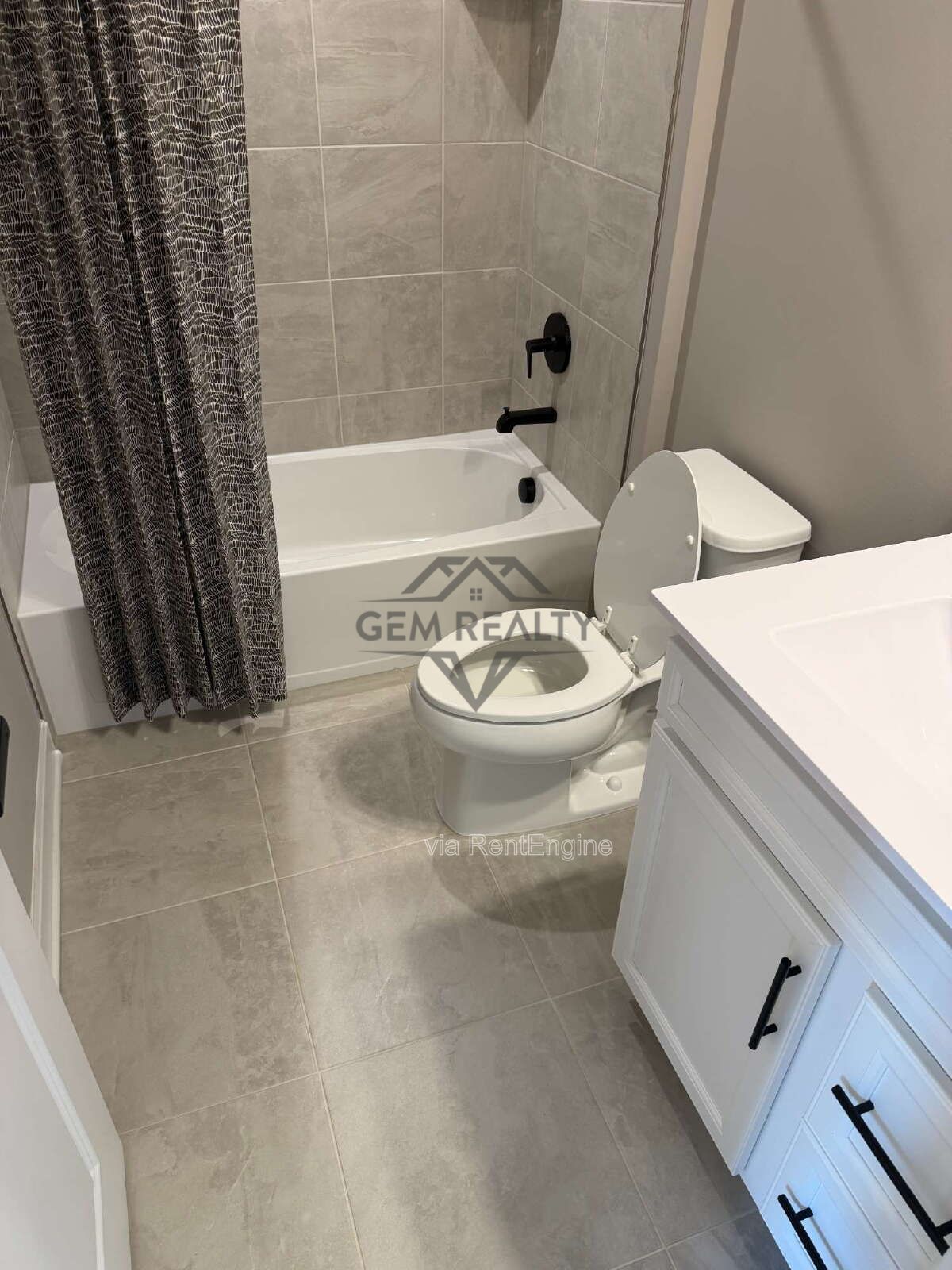 Welcome to Courthouse Commons Townhomes, where you can Rent a brand-new 3 BR 2.5 BA end unit townhome with a one-car garage and a spacious, open-concept floor plan designed for modern living. property image