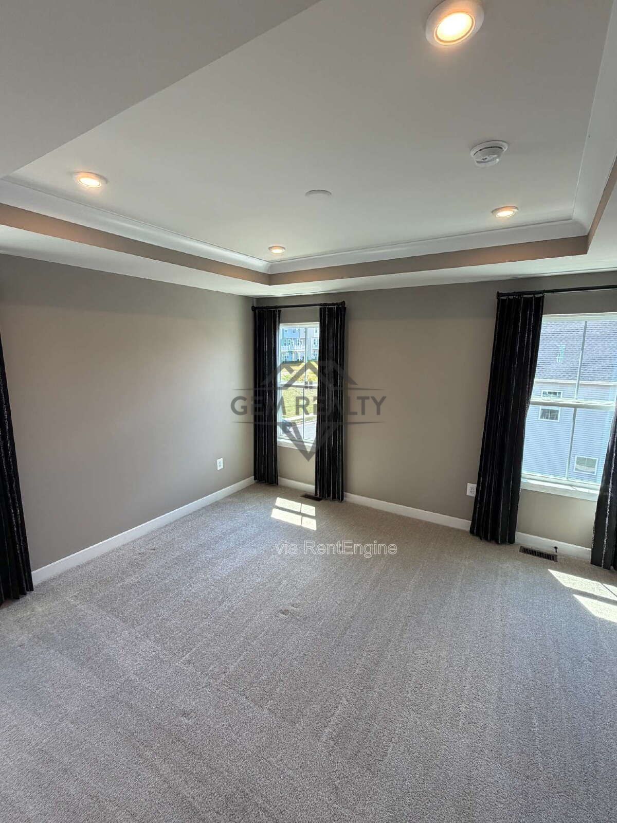Welcome to Courthouse Commons Townhomes, where you can Rent a brand-new 3 BR 2.5 BA end unit townhome with a one-car garage and a spacious, open-concept floor plan designed for modern living. property image