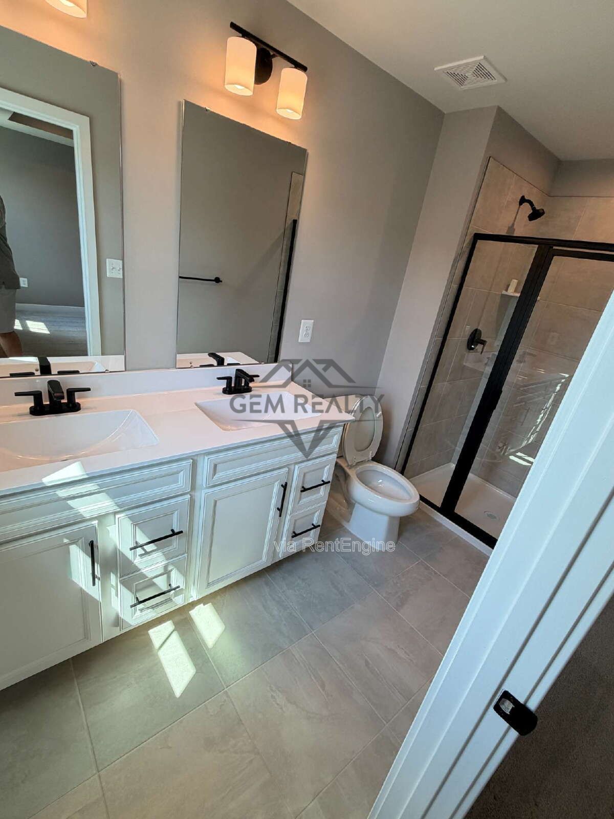 Welcome to Courthouse Commons Townhomes, where you can Rent a brand-new 3 BR 2.5 BA end unit townhome with a one-car garage and a spacious, open-concept floor plan designed for modern living. property image