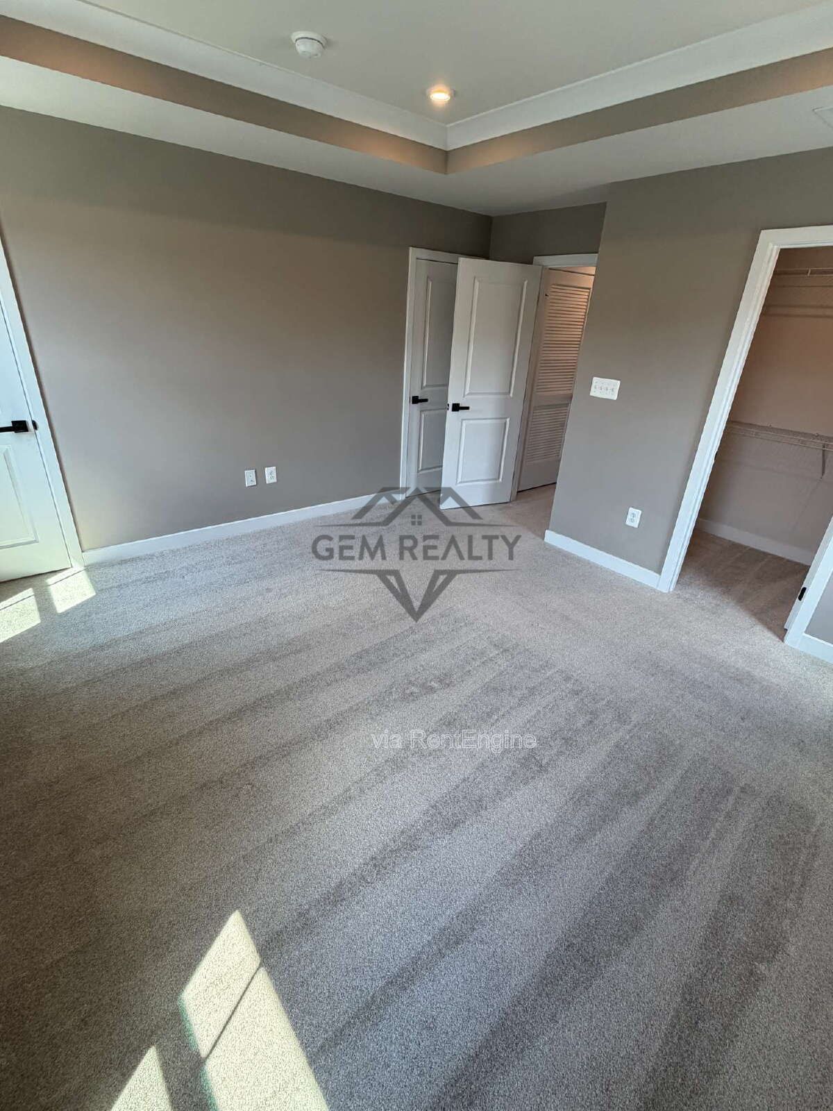Welcome to Courthouse Commons Townhomes, where you can Rent a brand-new 3 BR 2.5 BA end unit townhome with a one-car garage and a spacious, open-concept floor plan designed for modern living. property image