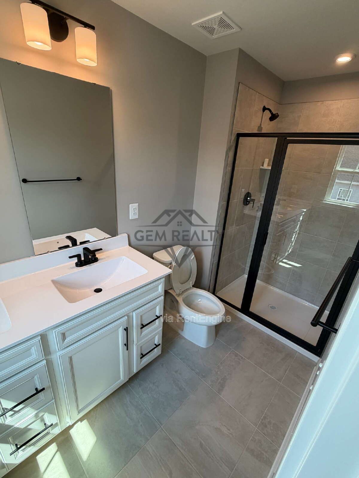 Welcome to Courthouse Commons Townhomes, where you can Rent a brand-new 3 BR 2.5 BA end unit townhome with a one-car garage and a spacious, open-concept floor plan designed for modern living. property image