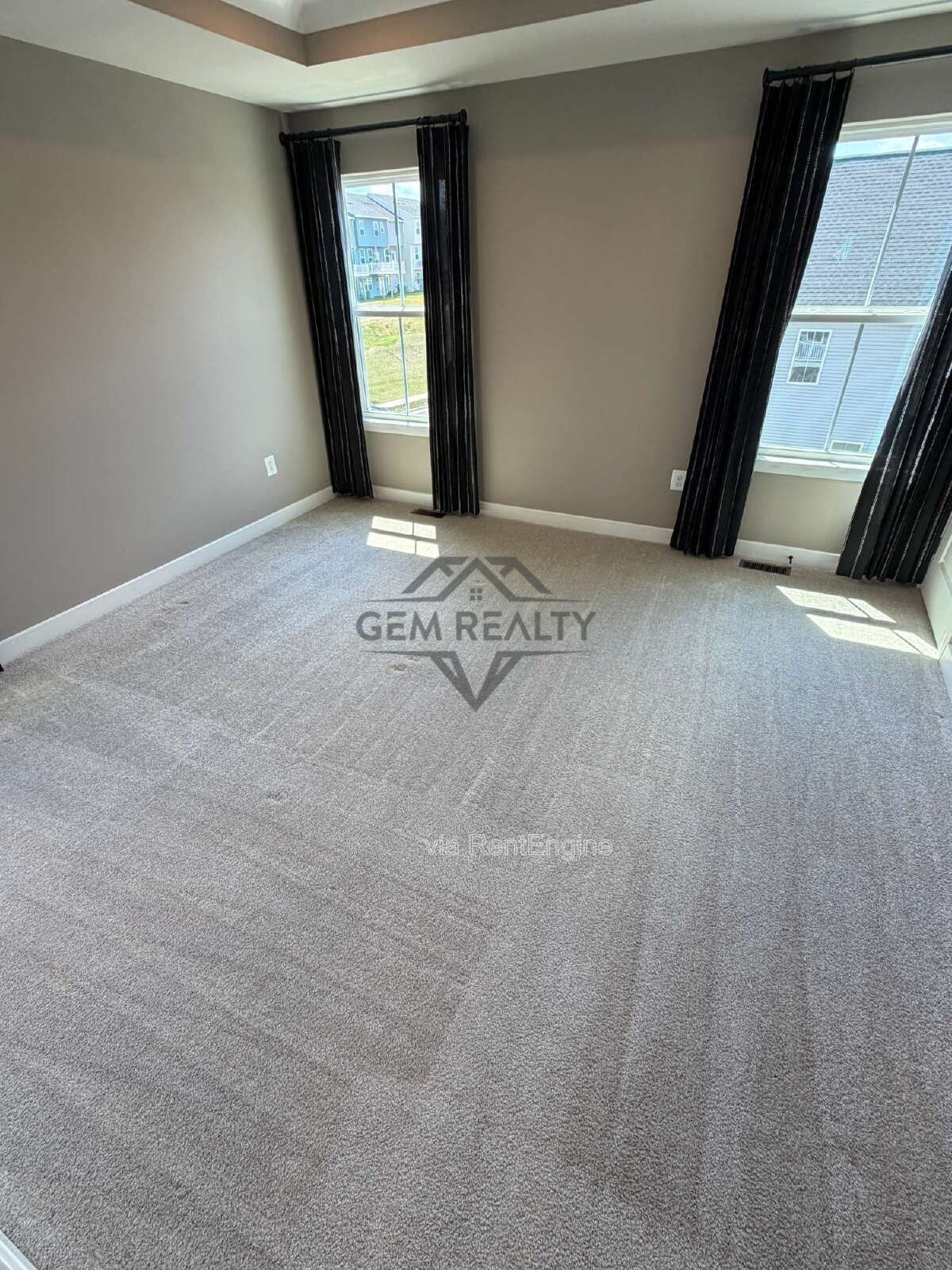 Welcome to Courthouse Commons Townhomes, where you can Rent a brand-new 3 BR 2.5 BA end unit townhome with a one-car garage and a spacious, open-concept floor plan designed for modern living. property image