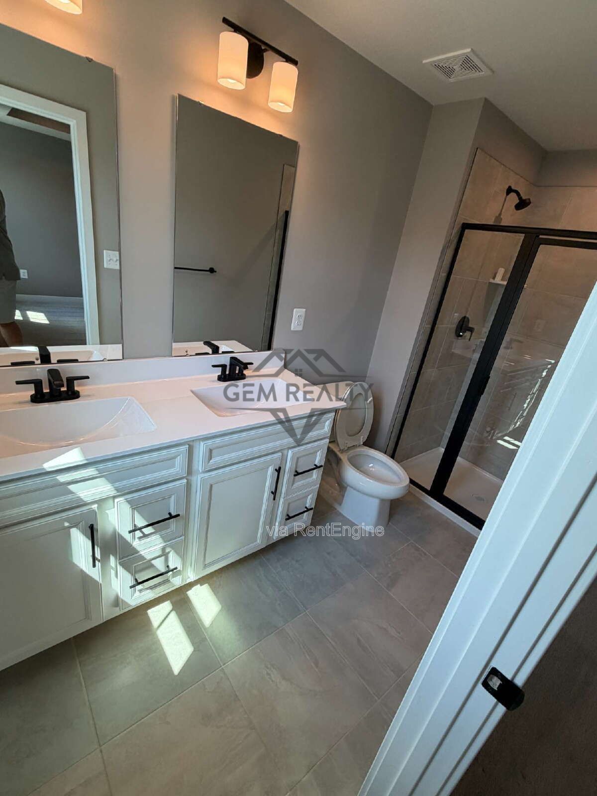 Welcome to Courthouse Commons Townhomes, where you can Rent a brand-new 3 BR 2.5 BA end unit townhome with a one-car garage and a spacious, open-concept floor plan designed for modern living. property image