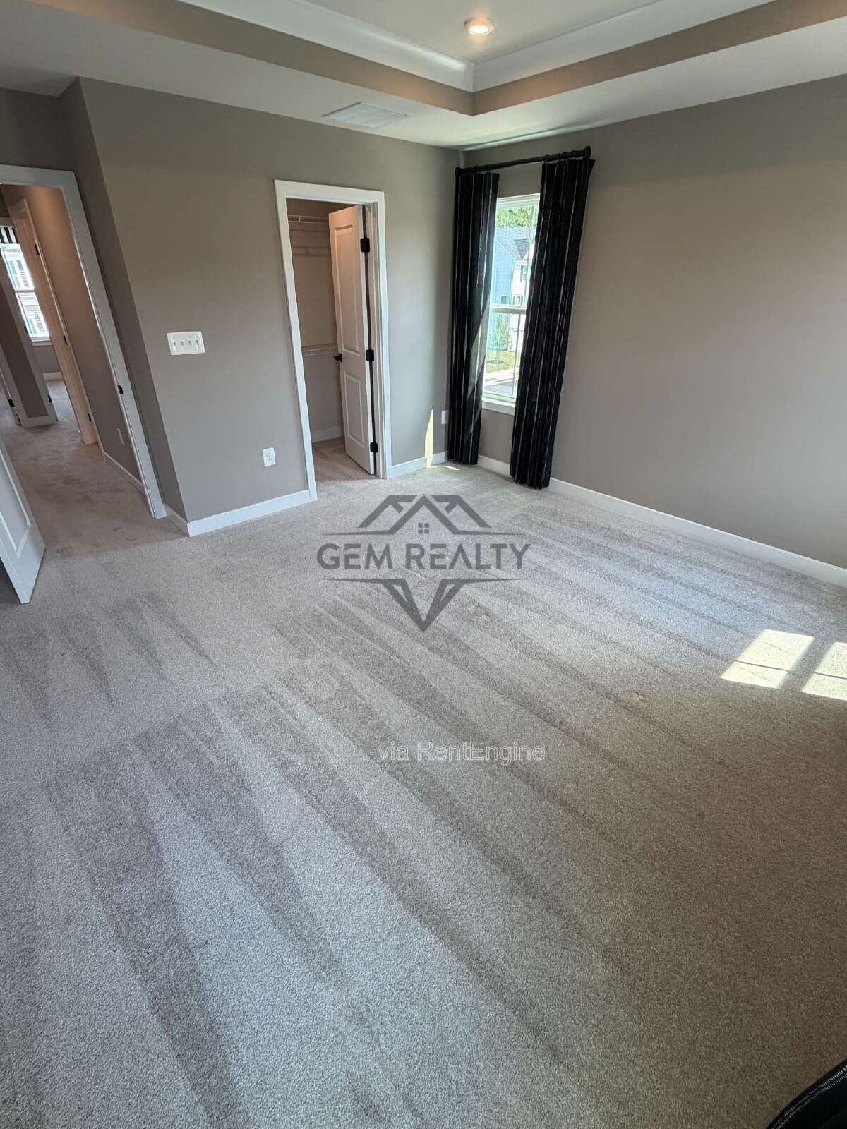 Welcome to Courthouse Commons Townhomes, where you can Rent a brand-new 3 BR 2.5 BA end unit townhome with a one-car garage and a spacious, open-concept floor plan designed for modern living. property image