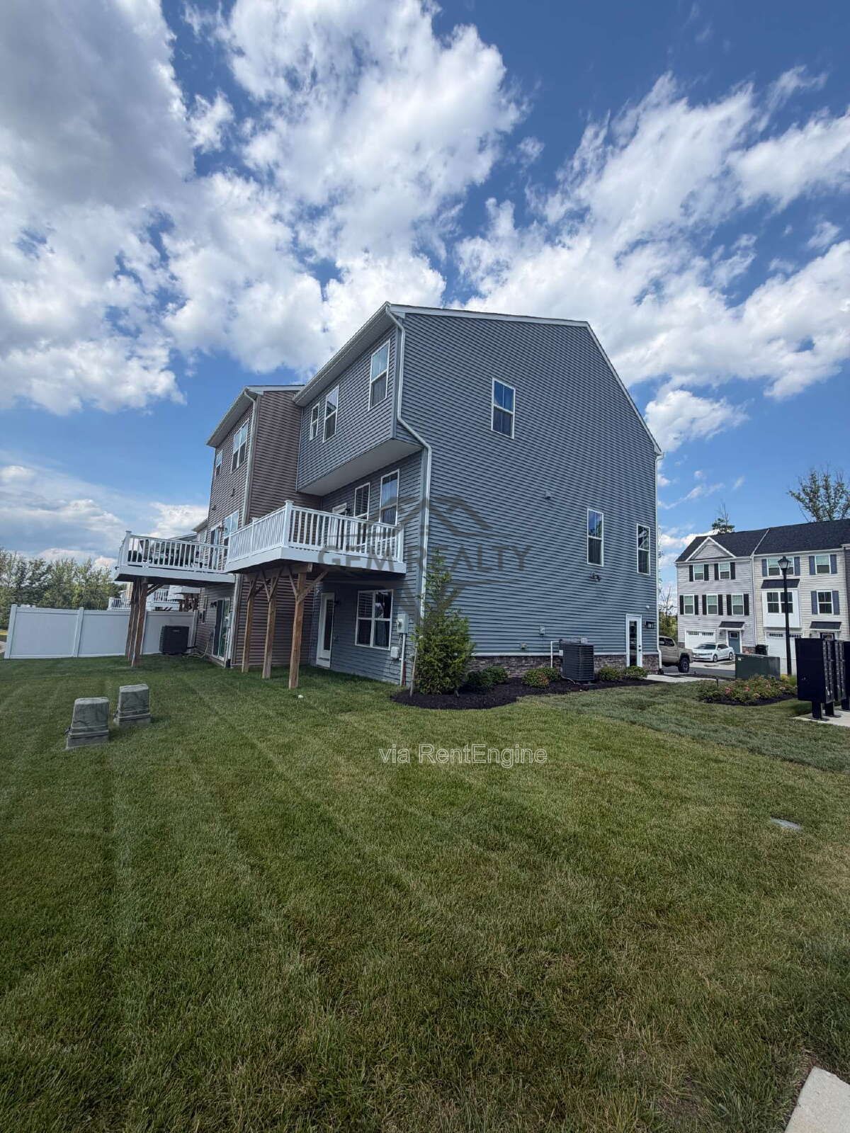 Welcome to Courthouse Commons Townhomes, where you can Rent a brand-new 3 BR 2.5 BA end unit townhome with a one-car garage and a spacious, open-concept floor plan designed for modern living. property image