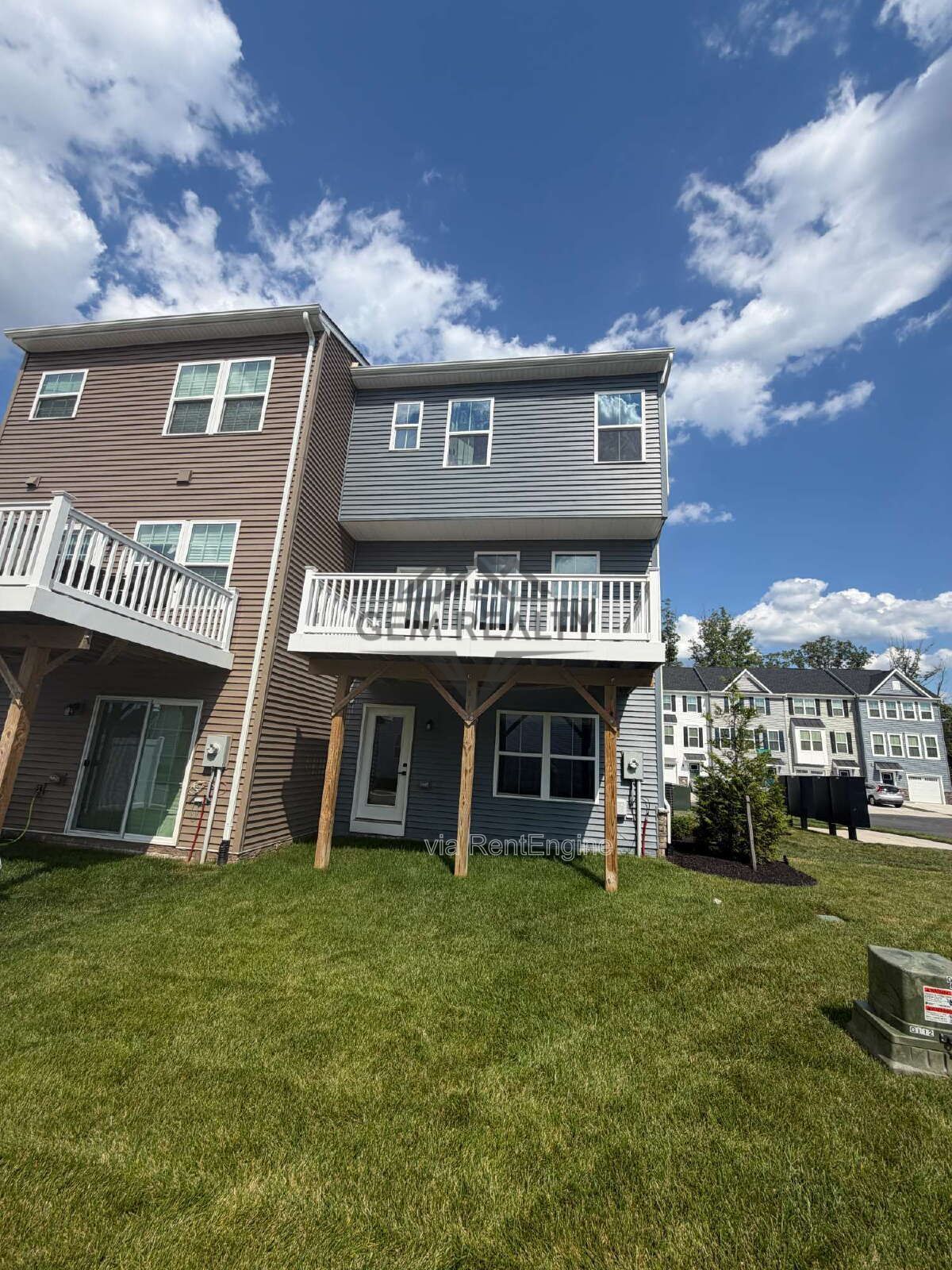 Welcome to Courthouse Commons Townhomes, where you can Rent a brand-new 3 BR 2.5 BA end unit townhome with a one-car garage and a spacious, open-concept floor plan designed for modern living. property image