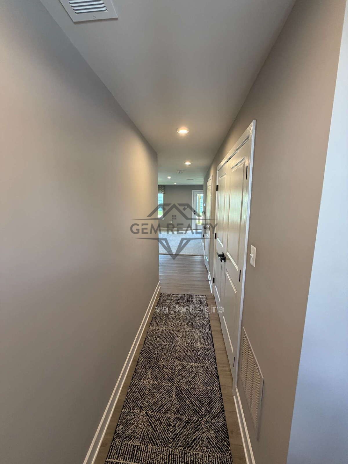 Welcome to Courthouse Commons Townhomes, where you can Rent a brand-new 3 BR 2.5 BA end unit townhome with a one-car garage and a spacious, open-concept floor plan designed for modern living. property image