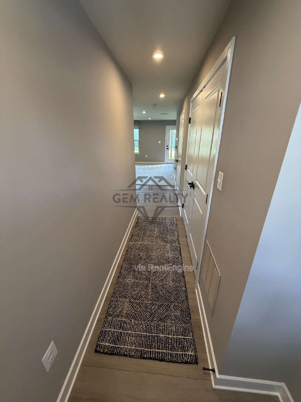 Welcome to Courthouse Commons Townhomes, where you can Rent a brand-new 3 BR 2.5 BA end unit townhome with a one-car garage and a spacious, open-concept floor plan designed for modern living. property image