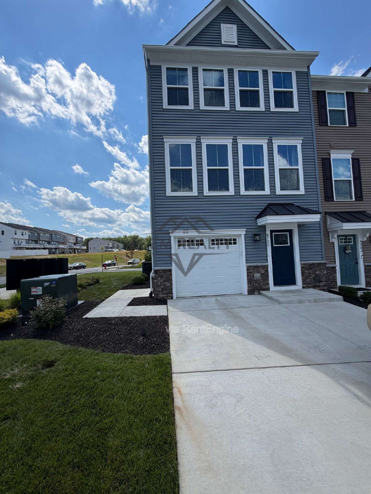 Welcome to Courthouse Commons Townhomes, where you can Rent a brand-new 3 BR 2.5 BA end unit townhome with a one-car garage and a spacious, open-concept floor plan designed for modern living. property image